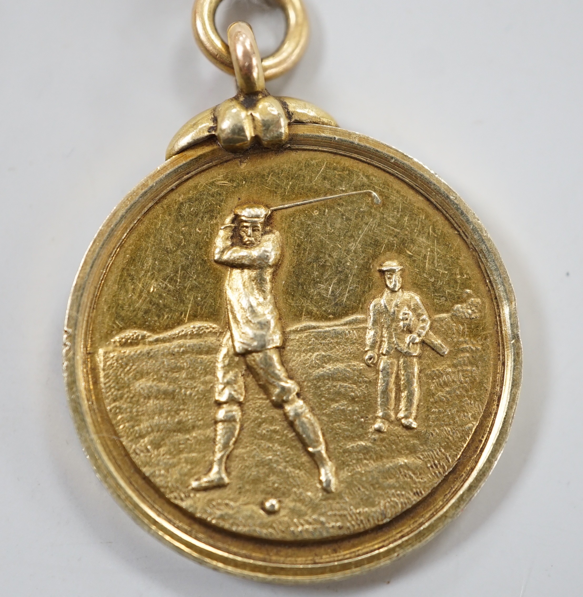 An Edwardian 15ct gold golfing medal, engraved 'Berwick Golf Club, 1902, Captn Prize R.R. Riddell won by I.A. McCreath', 26mm, 12 grams.